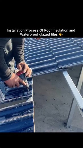 World_War on Instagram: "This post captures a worker installing blue color-coated metal roofing sheets, also referred to as steel roofing sheets or sometimes "glazed tiles" in some contexts. The person in the image is using a cordless drill to secure the panels to a light steel frame structure as part of a roof installation process. Roofing Sheet Details Material: These sheets are typically made from high-strength galvanized or galvalume steel, coated with a protective color finish for durabilit