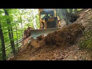 Bulldozer TG 120 works in the forest