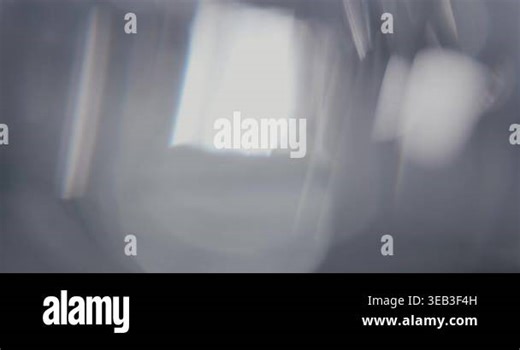 Abstract silver blurry background with moving lens flares and refractions. Delicate colors bokeh effect for luxury logo display. Grey-blue light leaks on a blurred background with copy space. Template for title design Stock Video Footage - Alamy