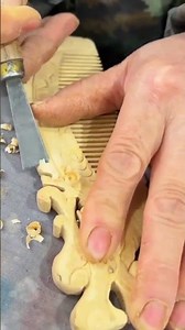 the process of smoothing a wooden comb using a special chisel