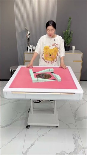 automatic folding mahjong table with built-in electronic tile shuffling and a matching top cover.