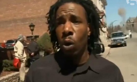 Manhole cover explodes during TV interview - video