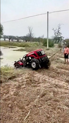 Excavator recovers submerged tractor from pond!
