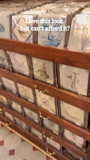 How to make DIY Delft tiles, no painting required 💅 Start with plain white tiles. These are $0.11 each! 💃🏻 Iron on a laminate sheet- this preps the tile for the sublimation! If you don’t do this, it won’t stick. 😇 Print out the Delft designs on sublimation paper. I bought the designs on Etsy. And then had another Etsy seller print the sheets. 🖨️ Use heat resistant tape to apply the designs to the tile. Iron it on ➡️ Take off the paper and tape and you have the perfect tile! 🙌🏻 If you aren