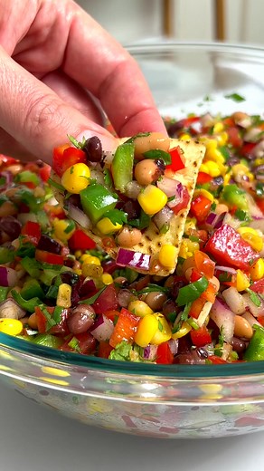 This easy recipe for Cowboy Caviar is fun, fresh, colorful, and endlessly adaptable. It makes a great dip, salad, side dish, or even a topping for grilled meats. Always a potluck favorite! https://www.culinaryhill.com/cowboy-caviar-recipe #CowboyCaviar #PotluckRecipe #ChipsAndDip | Culinary Hill