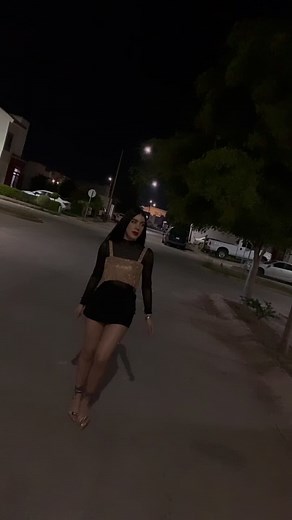 Stunning Nighttime Fashion Walk in a Black Dress