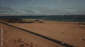4K aerial drone video of Atlantic Ocean coastline beach, west coast yellow sand dunes landscape, Namib Desert B2 coastal highway between towns Swakopmund and Walvis Bay in Namibia, southern Africa
