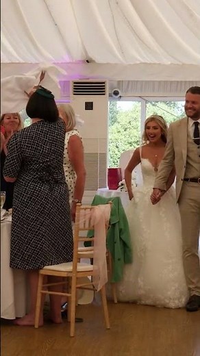 Couple Enter The Wedding Breakfast