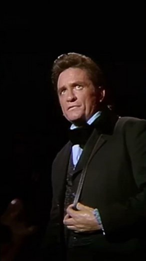 Johnny Cash performing Sunday morning coming down