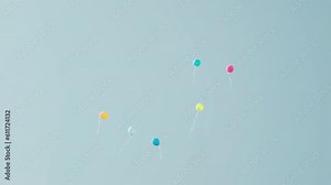 Colorful Balloons Flying in the Air. Party Balloons in Air. Balloons Flying Away. Helium Filled Balloons Flying