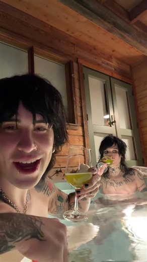 Two bros chilling in a hot tub