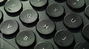 Black computer keyboard detail view closeup. Full HD with motorized slider.