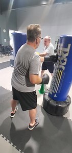 Here's RSB fighters, Pete and Charlie, going to town on the two bag hook station!🥊🏋‍♂️🥊 | Rock Steady Boxing The Woodlands
