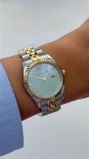 The watch you sold out in less than 24 hours is back and in a brand new colourway 🩵 Now with a dreamy aqua mother of pearl face, this limited edition watch is the perfect addition to your Summer jewellery looks! Head to our bio to shop @staceysolomon ’s Summer Collection now - be quick! ⏰ | Abbott Lyon