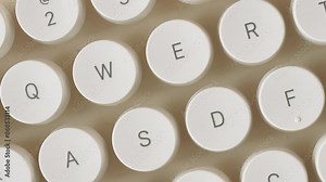 Rotating modern computer keyboard round keys. Close up QWERTY keyboard button in top view concept