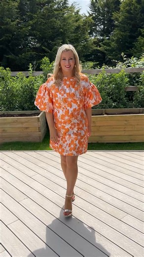 6K views · 11 reactions | One for the glam fashionistas  NEW Maeve Dress €79 • this Embossed Mini Dress is a striking occasion piece crafted from vibrant orange and gold stiff fabric that holds its structured silhouette beautifully. Fully lined for comfort, it features dramatic puff sleeves that add a high-fashion edge. This mini dress combines bold texture with expert tailoring, making it a standout choice for memorable events. | Ruby Rouge Boutique | Facebook