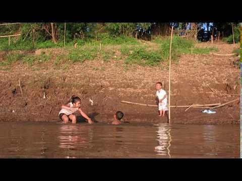 People taking a bath along mekong river