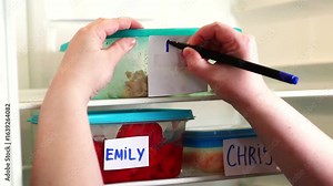 Man writing dramatic and angry note on meal container in work fridge. Office social media content, viral workplace trends and humor.