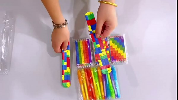 Happy Greetings 36 Pc Building Block Party Favors Set for 12 Kids Notebooks Magic Pens Wristband Birthday Classroom Prize