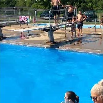 Guy doing awesome gainer off diving board