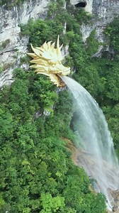 40K views · 1.5K reactions | A golden dragon head sculpture inlaid on a cliff is "spitting" water out its mouth. Does anyone know where the water comes from? Guizhou Province, China #China #dragon #water #gold #amazing | iChongqing | Facebook