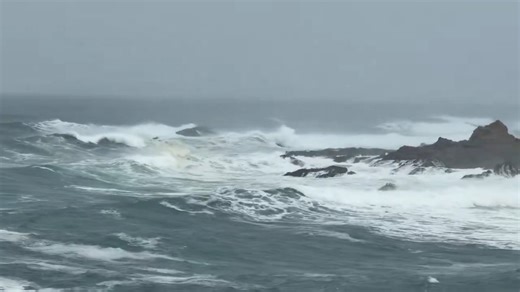 Rough surf crashes against rocky shore in California, USA