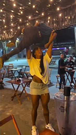 Insane Female Strength: Woman Lifts Man Overhead!