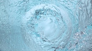 Super Slow Motion Shot of Water Vortex Splash on Black Background at 1000fps.