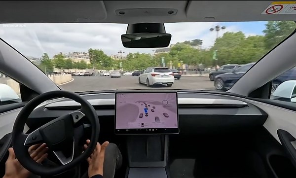 Tesla show off futuristic self-drive feature on vehicle in Paris