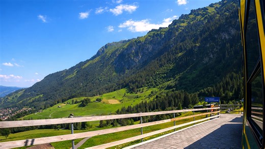 Switzerland alpine train ride with panoramic mountain views (4K)