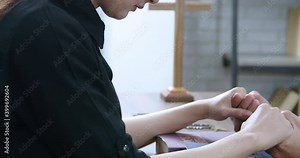 Closeup Asian Christian religion traditional spiritual studying praying with bible and hold hands for their hope and believed god forgivness at home or church