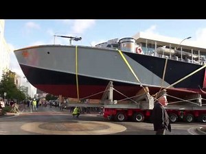 World War II PT boat cruises through the streets of New Orleans