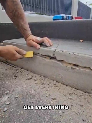 How to repair large crack on concrete slab side step. Part1 . Remove all loose surfaces. Tap with a hammer 🔨 this will help crumble internally to allow you to scrape out the cracks loose surfaces. #paintingprocess #renovation #paintingprocessvideo #housepainting #painter