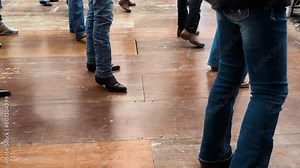 People dance with cowboy boots to typical American culture such as the Texan one. Group dances in company for fun. Quadrille conceptual Legs close up of tradition western folk