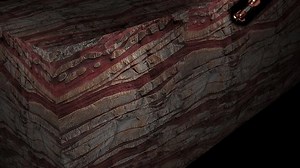Drilling down hole 3D animation view showing drill bit penetrating reservoir rock with drill cutting flowing out through annulus