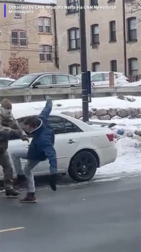 New video shows an ICE officer shoving a man who was obstructing an ICE vehicle. | https://www.kwch.com/2026/01/13/man-obstructing-ice-vehicle-shoved-by-officer-into-oncoming-traffic-video-shows/ | KWCH 12 News