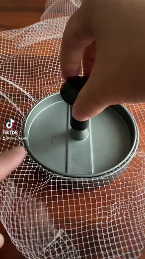 Hands Demonstrating Sieve Compression Technique