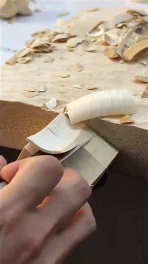 Using a Sharp Flat Chisel to Precisely Shave and Level the Edge of a Light Wood Block