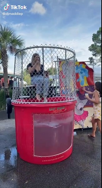 Champagne Dunk Tank Challenge: Girl Takes the Plunge!