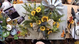 What do y'all think of this UNIQUE design?! This wreath is a must-make for the spring and summer months! Windmill decor is hot, hot, hot, so capitalize on this trend whether you make it for yourself to enjoy or make a few dozen and sell them at your next craft show. Here's the blog and FULL tutorial where we show you how to make it: https://howtomakewreaths.com/windmill-wreath/ | DecoExchange