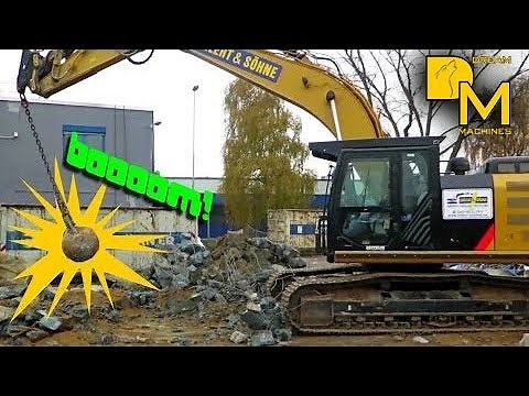 CATERPILLAR 324E crawler excavator showing skills smashing wrecking ball on solid concrete