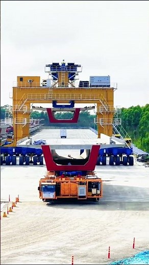 Heavy‑lift equipment at work in large‑scale bridge beam fabrication site