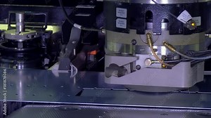 Cutting holes perforation stamping of metal sheets on industrial CNC machine. Automation of work. Refrigeration and ventilation equipment and air conditioners. Modern technologies.