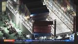 Shipping containers left dangling from cargo ship in Port of Long Beach