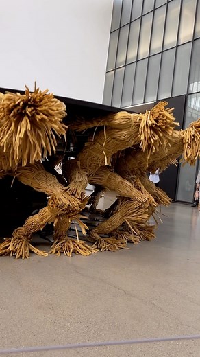 Architecture & Design on Instagram: "“Round Table” by @choeuram, is a work of art that touches on the concepts of kinetic art and technological experimentation, representing a group of 18 headless mechanical figures made of straw and balancing a black table on their backs. The disc, with a diameter of 4.5 metres, is in continuous motion, made to sway by the figures balancing the tilt through their own movements. The aim of the 18 figures is actually to carry towards themselves a sphere, ‘head’ a