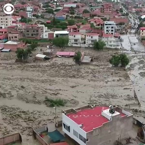 Drone footage shows flooding and muddied streets in Tiquipaya, a town in Bolivia, after heavy rains caused the Taquiña River to jump its banks. https://cbsn.ws/2PhMdoT | CBS News