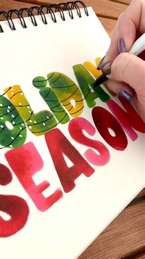 Did you see where I filmed this? 😅 The holiday season finds me everywhere but at my desk, so we’ll just make do! One month til Christmas… 😳 #letteringvideo #letteringideas #itstheholidayseason #ohuhumarkers | Lettering by Karen