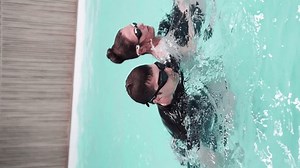 Relaxing aquatic journey captured in synchronized swim sequence at tranquil poolside.
