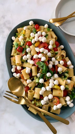 Juicy summer tomatoes pair with BelGioioso Fresh Mozzarella Pearls for a flavorful pasta salad that's sure to please. We partnered with Food52 to create this how-to video! https://food52.com/p/say-cheese | BelGioioso Cheese