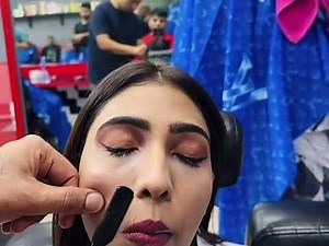 Girl gets a face shave in Barbershop with Razor